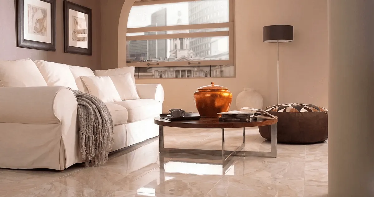 Modern living room with professionally installed marble flooring, a beige sofa, coffee table in Huntsville, AL