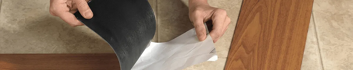 A professional installing vinyl flooring in Huntsville, AL